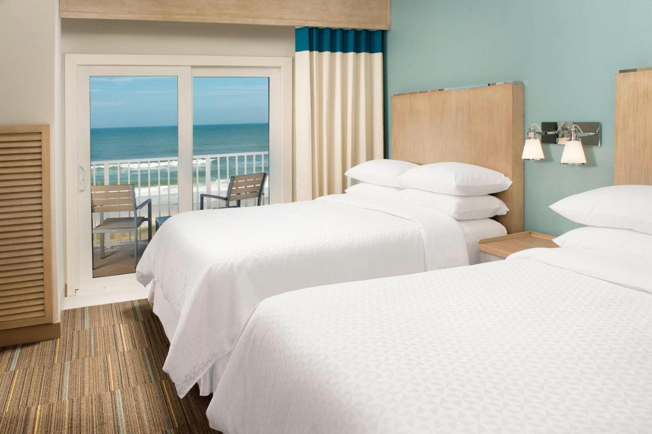 Suite Executive con 2 camas grandes, balcón y sofá cama - Frente al mar